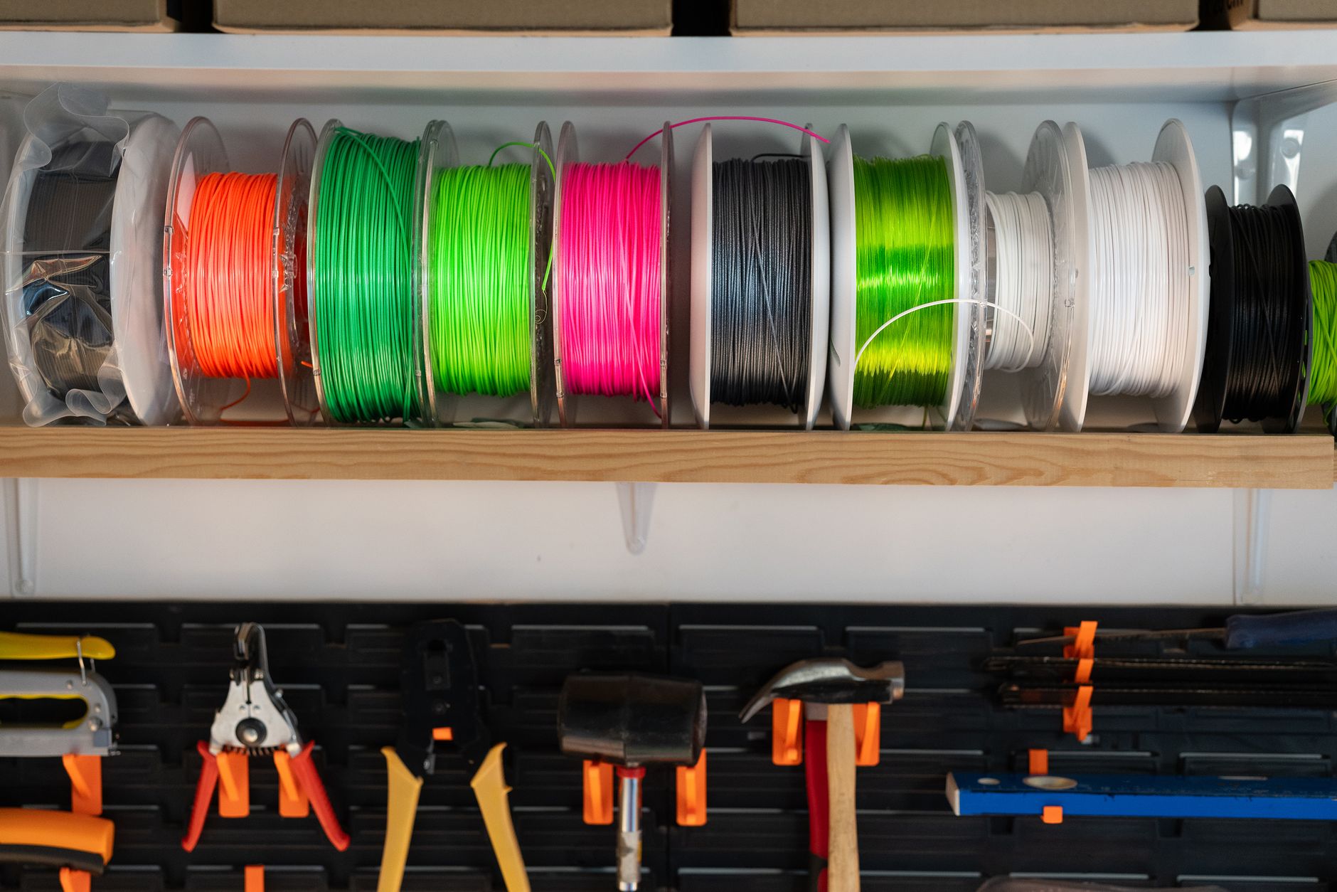 Desktop 3D printer creating a custom product inside a home workshop