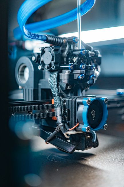 Creality Sonic Pad touch screen mounted beside a desktop 3D printer