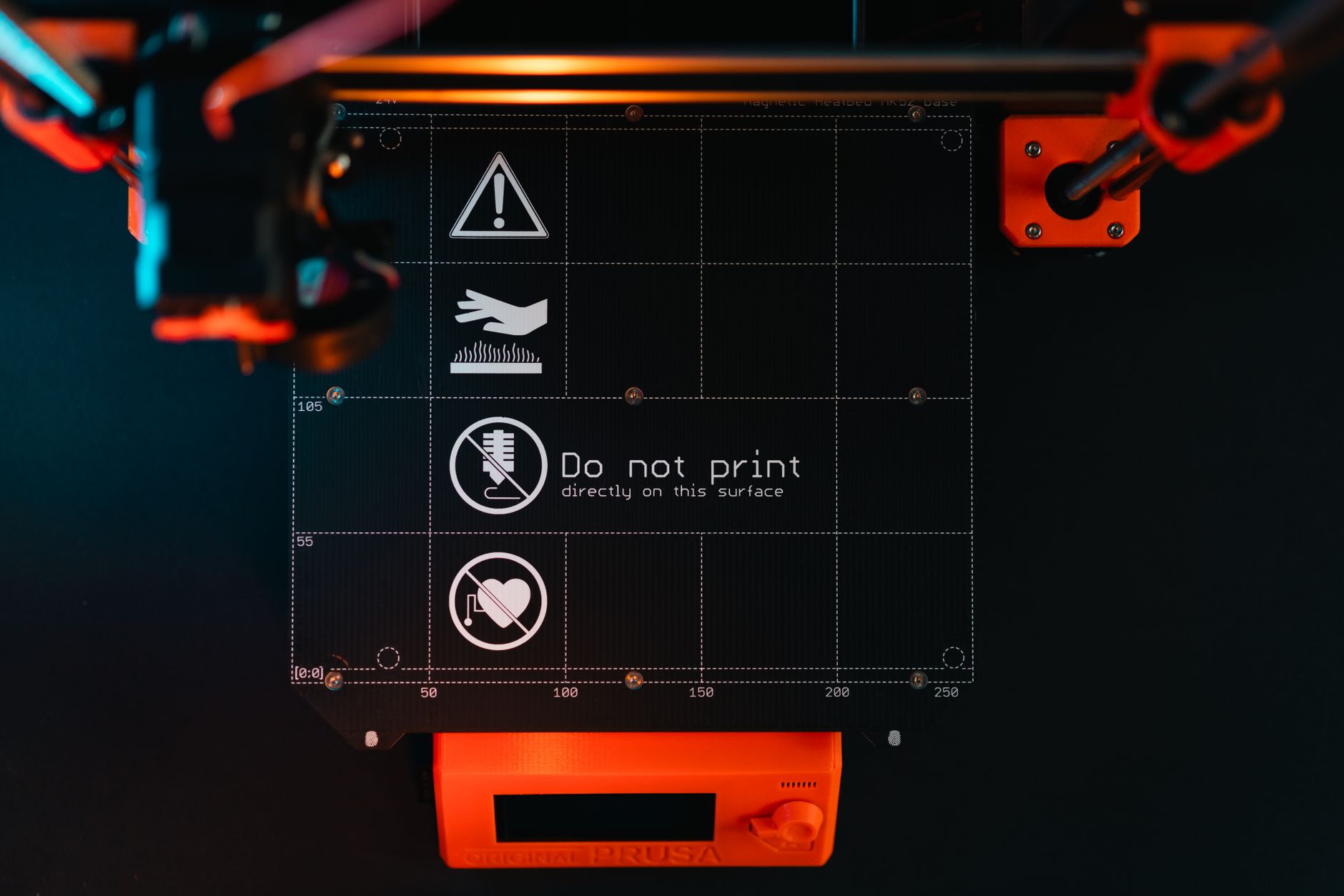 Prusa MK4 open-frame 3D printer printing an orange part